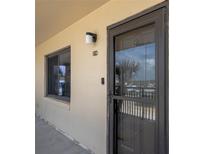 Exterior view of front door and window with unit number at beach condo at 2222 Ocean Shore Blvd # 304B, Ormond Beach, FL 32176