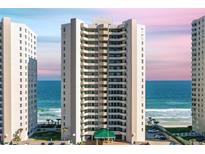 Exterior view of the condominium building showcasing ocean views and a well-maintained facade at 3315 S Atlantic Ave # 1406, Daytona Beach Shores, FL 32118