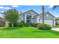 Charming single-story home featuring a well-maintained lawn and manicured landscaping at 809 Brightview Dr, Lake Mary, FL 32746