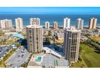 Stunning aerial view of beachfront condo buildings and the sparkling ocean at 1 Oceans West Blvd # 2A1, Daytona Beach, FL 32118