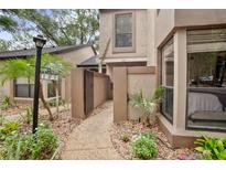 Inviting condo exterior featuring a private entry, natural light, and meticulous landscaping at 940 Douglas Ave # 189, Altamonte Springs, FL 32714