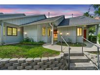 Charming one-story home features inviting entrance with well-kept lawn and decorative stone retaining wall at 101 N Hill Ave # 6, Deland, FL 32724