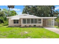 Charming single-story home featuring a well-maintained lawn and neutral exterior color at 2633 Yale Rd, South Daytona, FL 32119