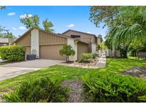Charming townhome with attached garage, lush landscaping and inviting curb appeal at 8 Rising Moon Trl, Ormond Beach, FL 32174