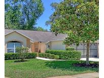 Charming single story home with well-maintained landscaping and a two car garage at 2051 Sherwood Forest Dr, Orange City, FL 32763