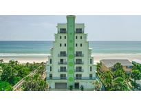 Beachfront condo featuring ocean views and a unique art deco architectural design with private balconies at 2801 Hill St # 801, New Smyrna Beach, FL 32169