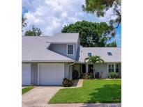 Charming home with a well-maintained lawn and attached garage, providing both curb appeal and convenience at 955 Grayling Ct # B, Port Orange, FL 32127