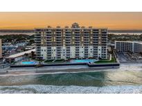 Stunning beachfront condo building with balconies and ocean views, offering luxurious coastal living at its finest at 2403 S Atlantic Ave # 410, Daytona Beach, FL 32118