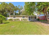 Charming single-story home with well-maintained lawn and lush landscaping for a welcoming curb appeal at 442 Dorothy Ave, Daytona Beach, FL 32117