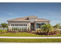 One-story home with a two-car garage and landscaped lawn at 294 Prickly Pear Ct, Lady Lake, FL 32159