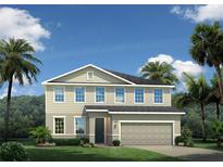 Two-story home with gray siding, gray roof, and a two-car garage at 1202 Whispering Ln, Minneola, FL 34715