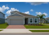 Charming single-Gathering home features a two-car garage, landscaped yard and a well-manicured lawn at 500 Crossings Ave, St Cloud, FL 34771