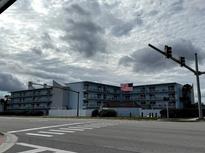 Building exterior, showcasing its location and curb appeal at 3700 S Atlantic Ave # 405, New Smyrna Beach, FL 32169