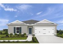Charming single-story home with a well-manicured lawn and a two-car garage at 2158 Tennessee St, Sumterville, FL 33585