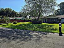 Well-maintained lawn and landscaping enhance this charming one-story home's curb appeal at 600 Se 52Nd Ave, Ocala, FL 34471