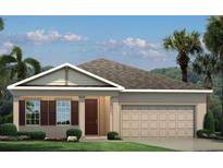 Charming single-story home featuring a neutral color palette, complemented by neat landscaping and a two-car garage at 1314 Whispering Ln, Minneola, FL 34715