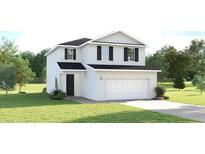 Charming two-story home with white siding, a two-car garage, and a well-manicured lawn at 5039 Bear Lake Loop, Deland, FL 32724