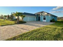 Beautiful one-story home featuring a spacious driveway and lush landscaping at 1567 Lake Reserve Dr, Deland, FL 32724