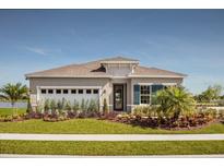 Charming single-story home with a well-manicured lawn, colorful landscaping, and a welcoming entrance at 1916 Quail Fields Cir, Winter Haven, FL 33884