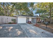 Charming single-story home with a well-maintained front yard, long driveway, and a one-car garage at 700 Crestwood Way, Winter Springs, FL 32708