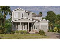 Charming two-story home with a well-maintained lawn and beautiful landscaping at 9432 Emerald Berry Dr, Winter Garden, FL 34787