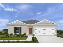 Charming single-story home with a well-manicured lawn and inviting front entrance with a gray and white color scheme at 416 Harvard Ct, Dundee, FL 33838