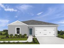 Charming single-story home with a gray exterior, a two-car garage, and neatly landscaped front yard at 744 Cantaberry Dr, Dundee, FL 33838