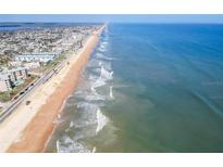 Gorgeous aerial view of the beach and shoreline from a coastal condo community at 2600 Ocean Shore Blvd # 111, Ormond Beach, FL 32176