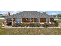 Charming single-story home with decorative touches and well-maintained landscaping at 7355 Se 106Th Pl, Belleview, FL 34420