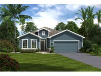 Charming single-Gathering home with a neatly manicured lawn, a two-car garage, and lush, mature landscaping at 1310 Whispering Ln, Minneola, FL 34715