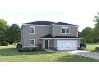 Charming two-story home with well-maintained lawn and attached two car garage at 1502 Landon Ln, Haines City, FL 33844
