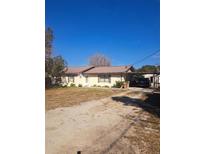 Inviting single-story home with a carport at 11301 Huggins St, Leesburg, FL 34788