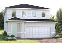 Charming two-story home with a two-car garage, complemented by lush landscaping at 6501 Domizio Dr, Winter Haven, FL 33884