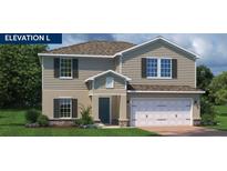 Charming two-story home featuring a neutral color palette, two-car garage, and well-manicured lawn at 1362 Laramie Way, Haines City, FL 33844