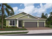 Charming one-story home featuring a two-car garage, lush lawn, and verdant landscaping at 764 Mystic Gardens Dr, Apopka, FL 32703