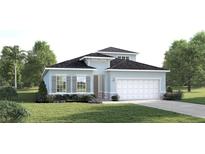 Charming single-Gathering home with light blue exterior, landscaped yard, and attached two-car garage at 283 Prickly Pear Ct, Lady Lake, FL 32159