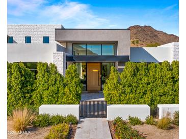 Modern home with clean lines and a landscaped front yard at 6554 N 40Th Pl, Paradise Valley, AZ 85253
