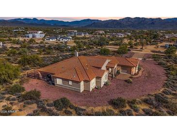 Aerial view of single-story home with tile roof and desert landscaping at 31416 N 166Th Pl, Scottsdale, AZ 85262