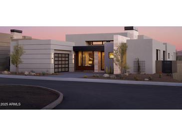 Modern home with sleek design, neutral colors, and landscaped yard at 28101 N 109Th Way, Scottsdale, AZ 85262