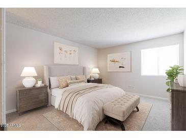 Bright bedroom with a comfortable bed and stylish decor at 2938 N 61St Pl # 114, Scottsdale, AZ 85251