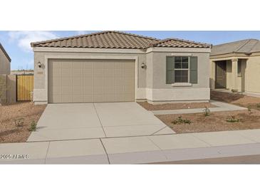 Charming single-story home featuring a neutral color palette, and a spacious two-car garage at 5688 S 243Rd Dr, Buckeye, AZ 85326