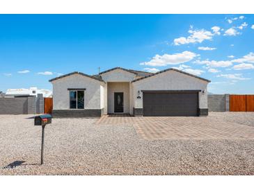 New single-story home with a two-car garage and attractive landscaping at 4160 N Kioha Dr, Eloy, AZ 85131