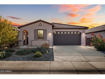 One-story home with a two-car garage and desert landscaping at 12179 E Sereno Rd, Gold Canyon, AZ 85118