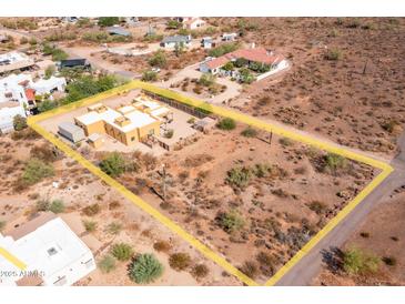 Aerial view showing a single-story home with surrounding desert landscape at 323 W Quartz Rock Rd, Phoenix, AZ 85085