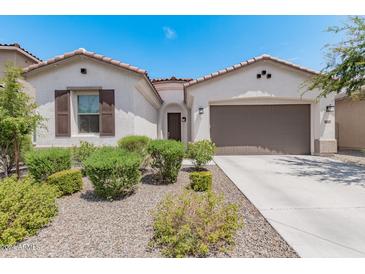 One-story home with two-car garage and landscaped front yard at 22630 E Mewes Rd, Queen Creek, AZ 85142