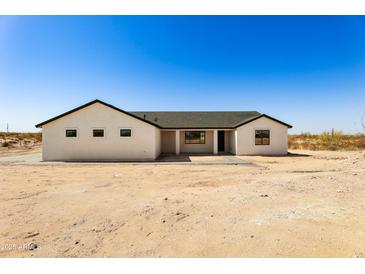 Charming home with a desert landscape and a classic-style exterior at 22750 E Roper Ln, Florence, AZ 85132