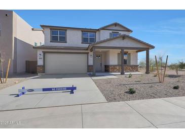 Charming two-story home featuring a covered porch and a two-car garage on a sunny day at 4106 W Eli Dr, San Tan Valley, AZ 85144