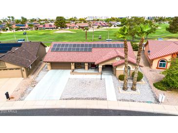 Single-story home with solar panels and desert landscaping, near golf course at 18822 N Grandview Dr, Sun City West, AZ 85375