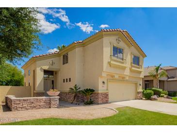 Two-story home with a tile roof, decorative accents, and a well-maintained front yard at 3327 S Felix Way, Chandler, AZ 85248