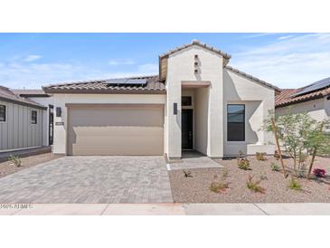 Charming single-Gathering home with a tile roof, desert landscaping, and a paved driveway, inviting curb appeal at 20306 W Turney Ave, Buckeye, AZ 85396